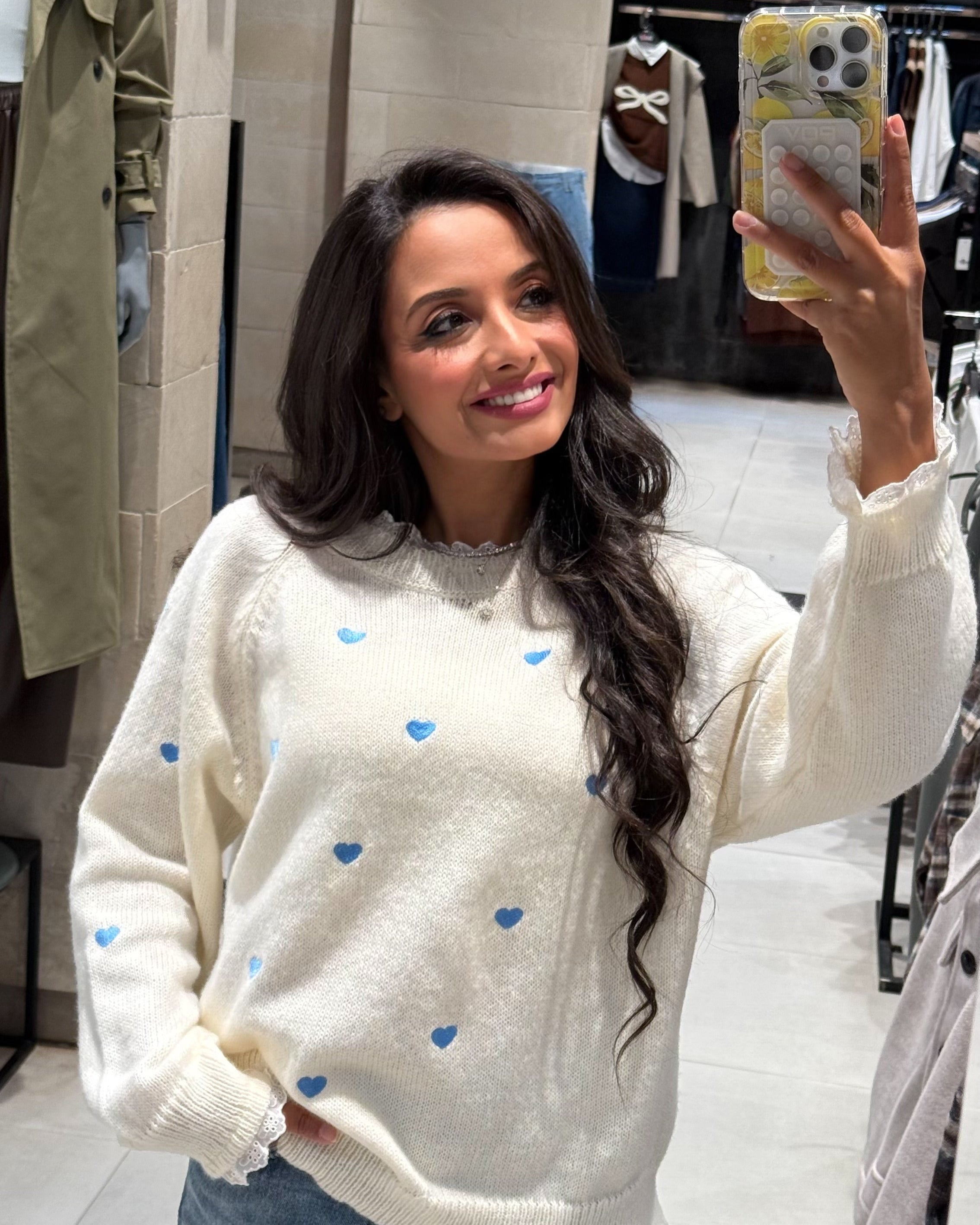 Pullover with hearts and a lace on the neck and sleeves