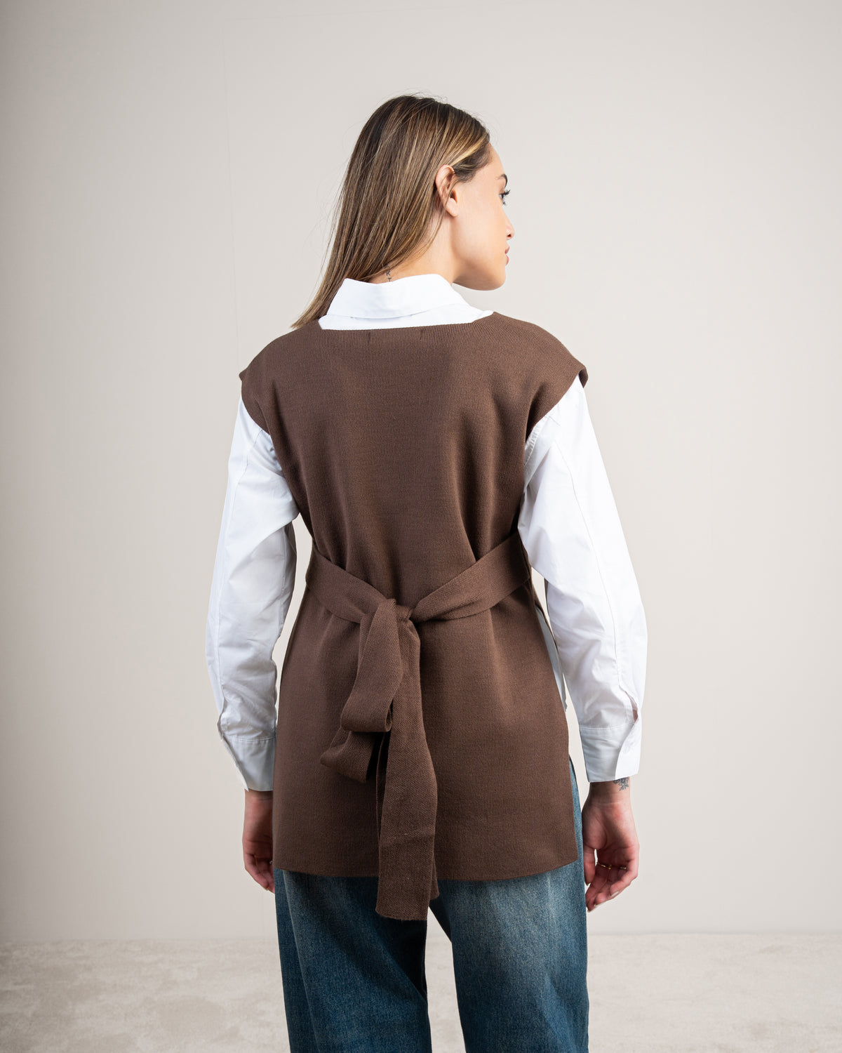 Knit vest with a tie-back detail