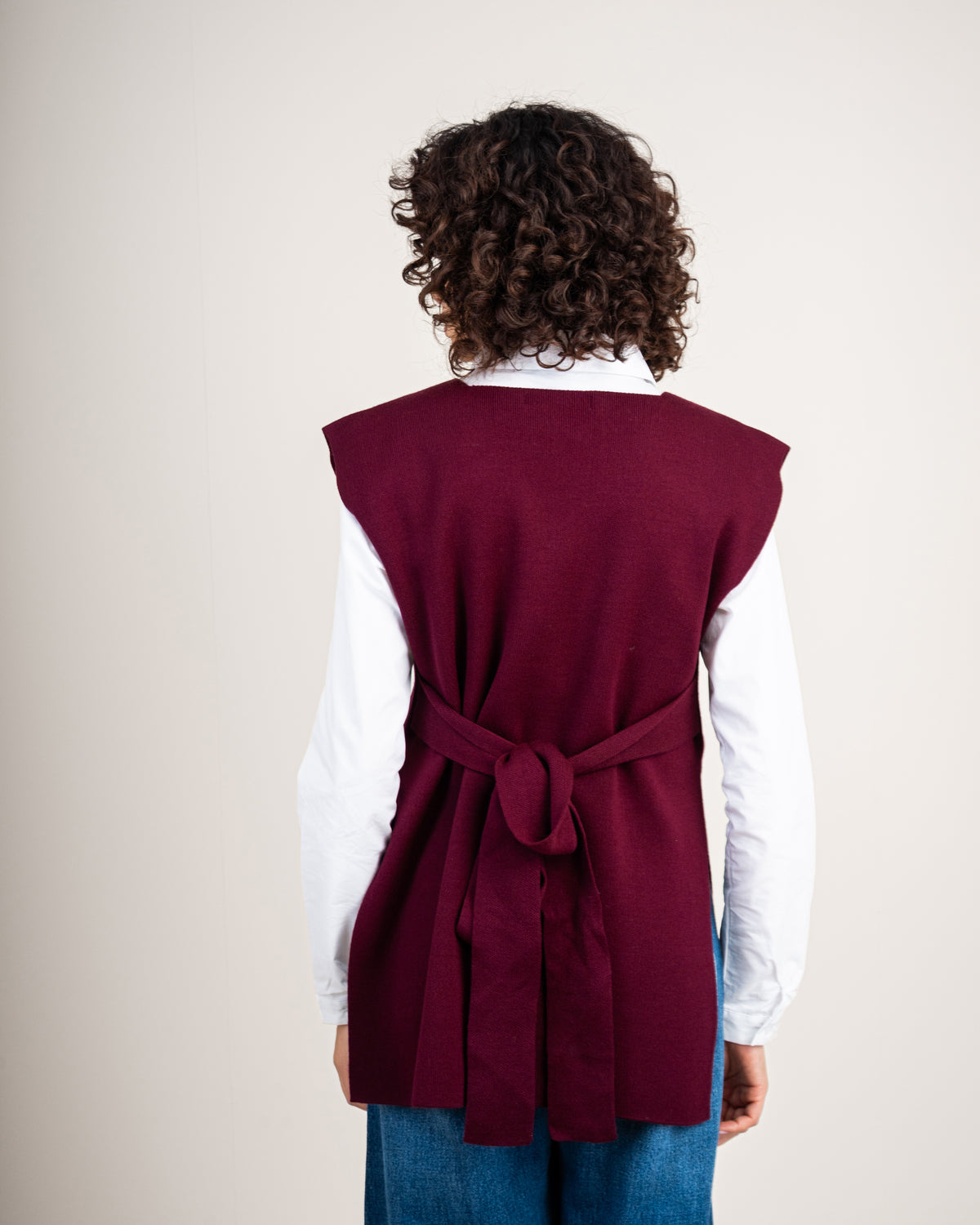 Knit vest with a tie-back detail