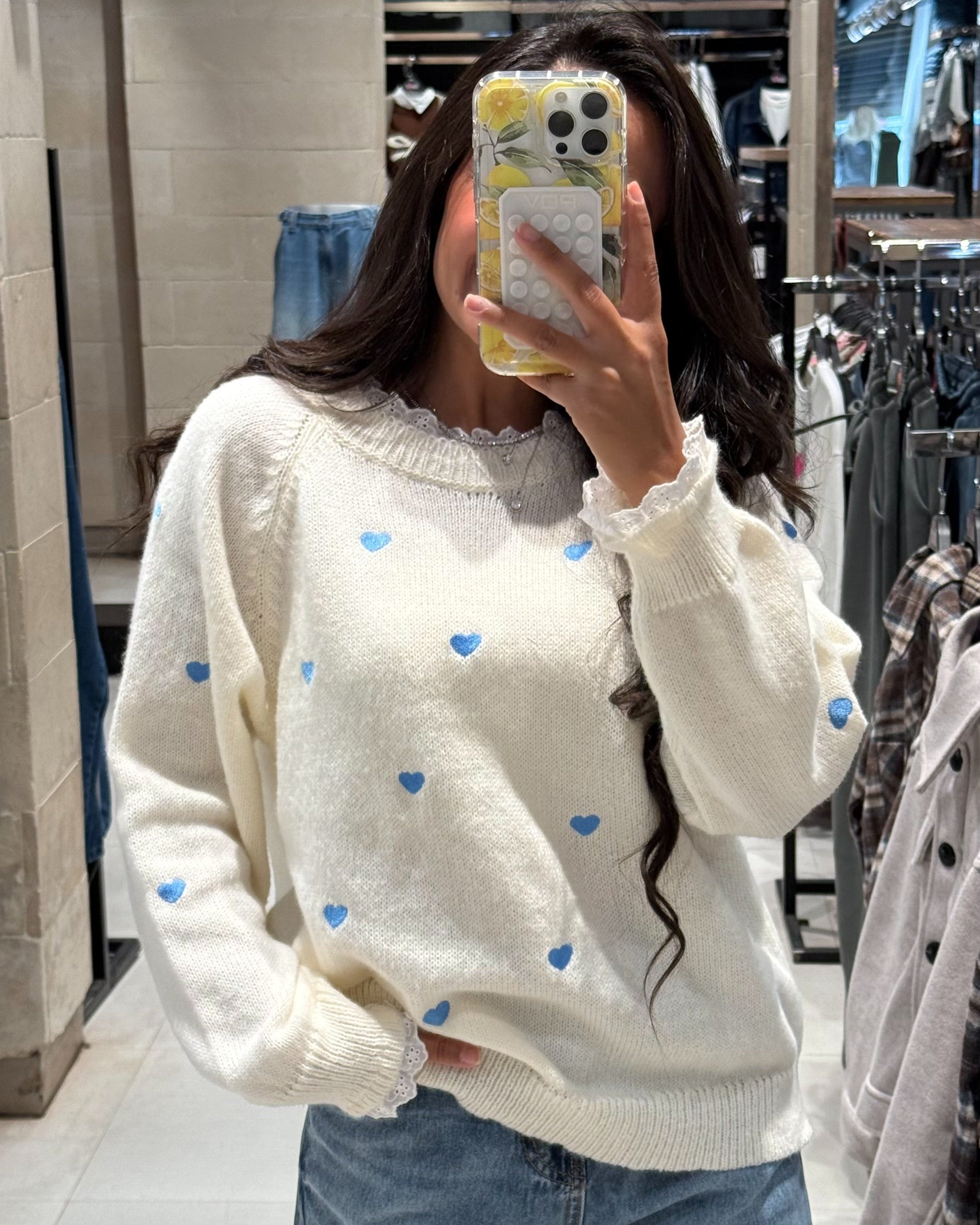 Pullover with hearts and a lace on the neck and sleeves