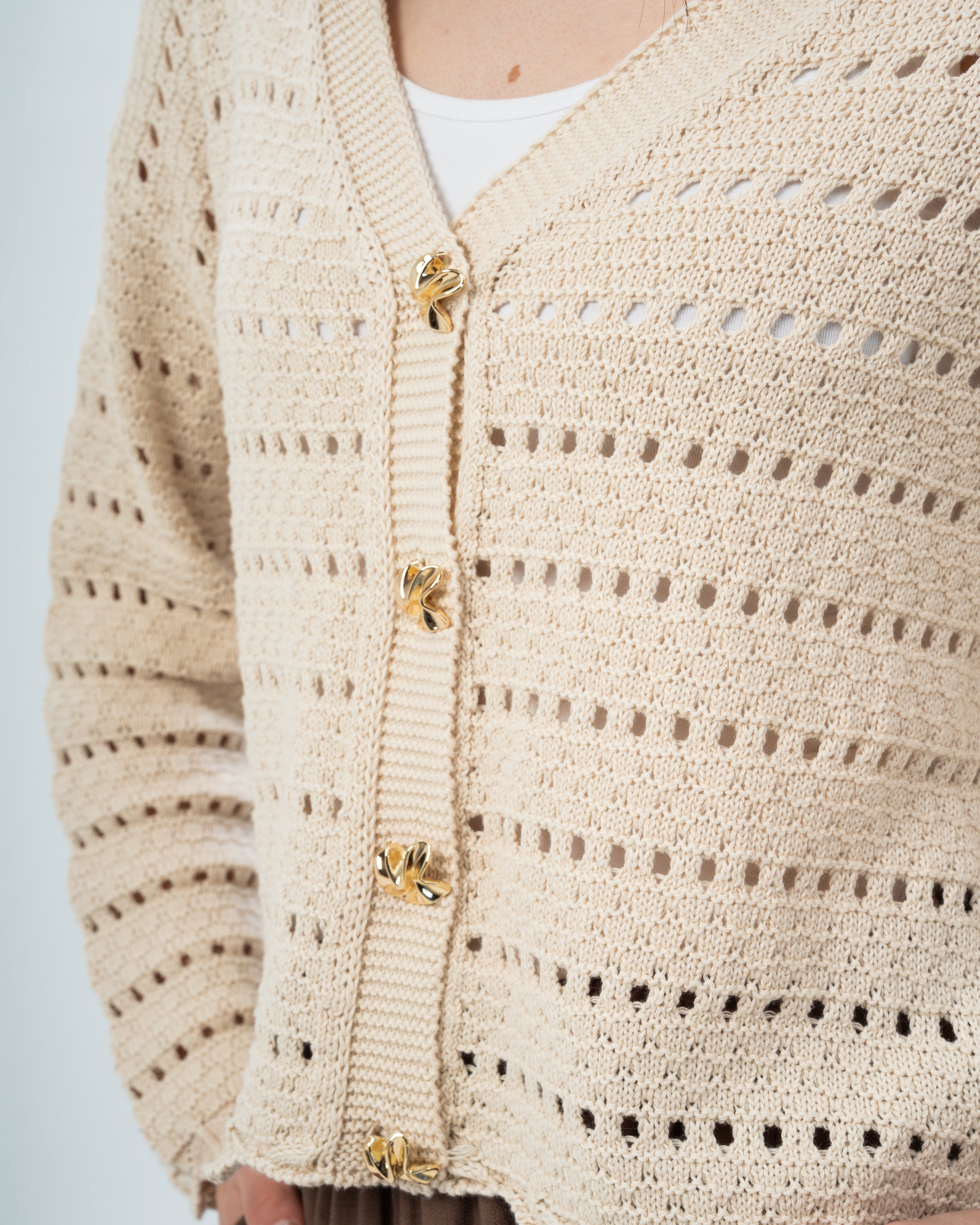 knitted Jacket with buttons.