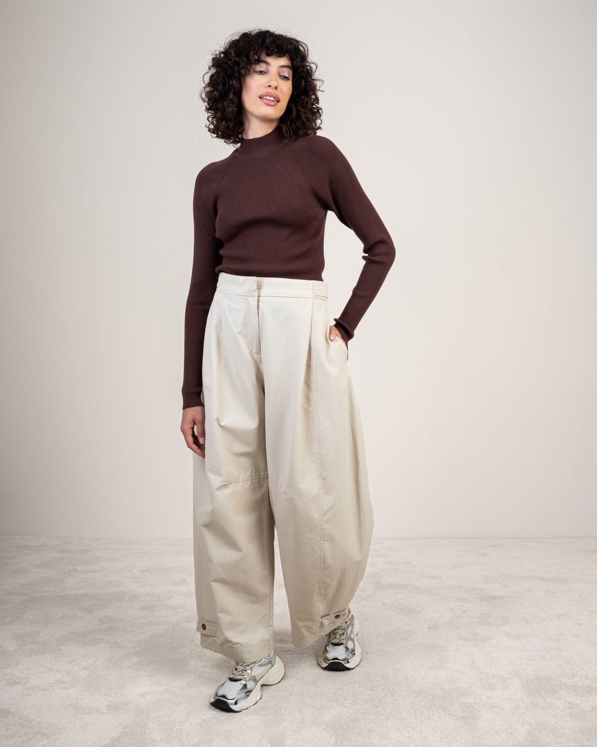 Gabardine trousers with a button