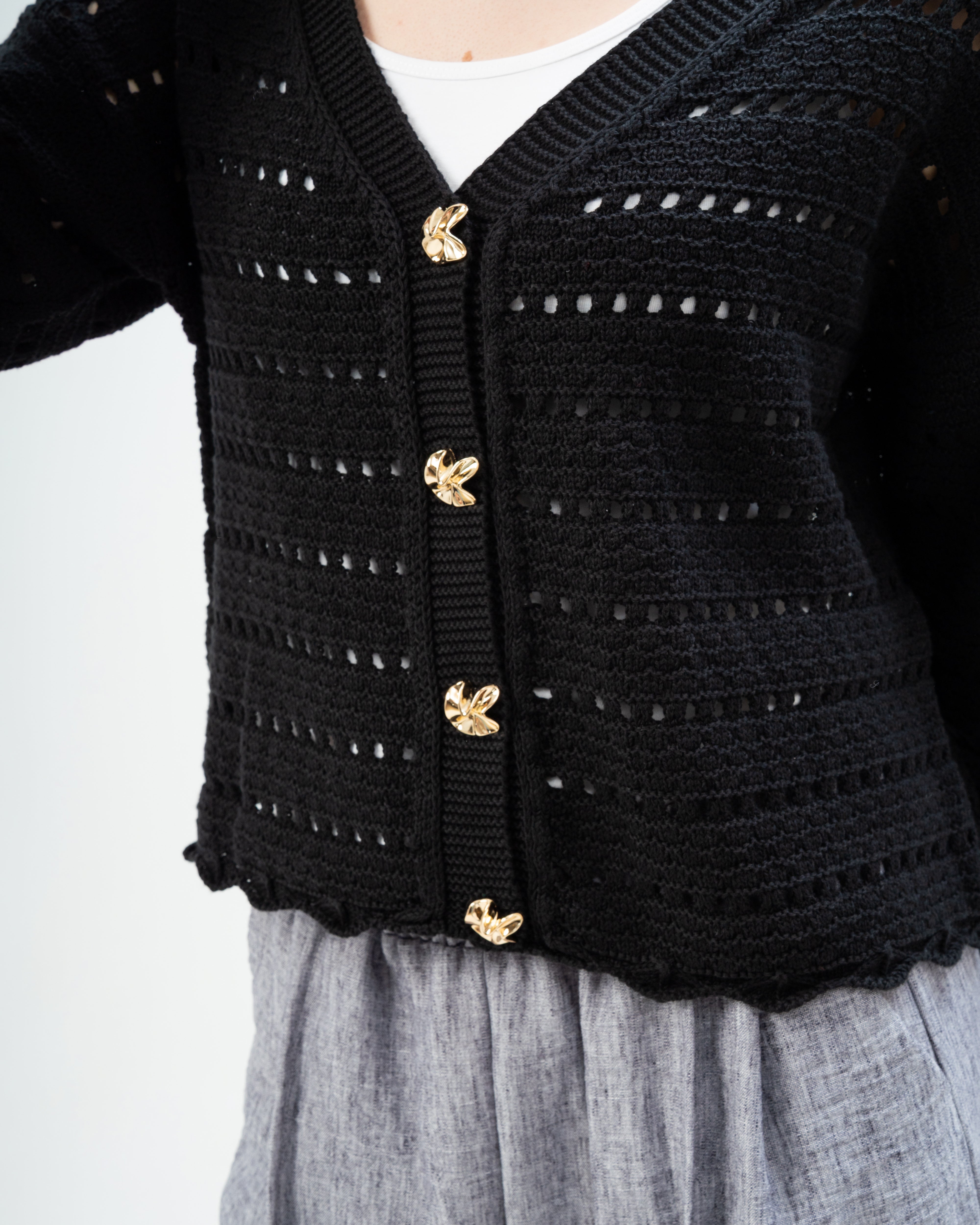 knitted Jacket with buttons.
