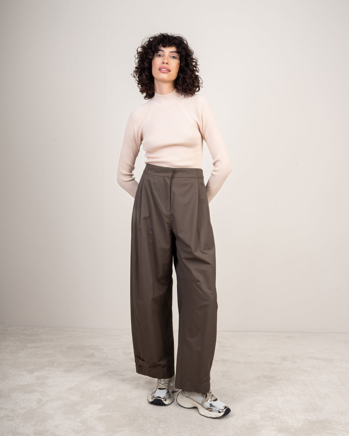 Gabardine trousers with a button