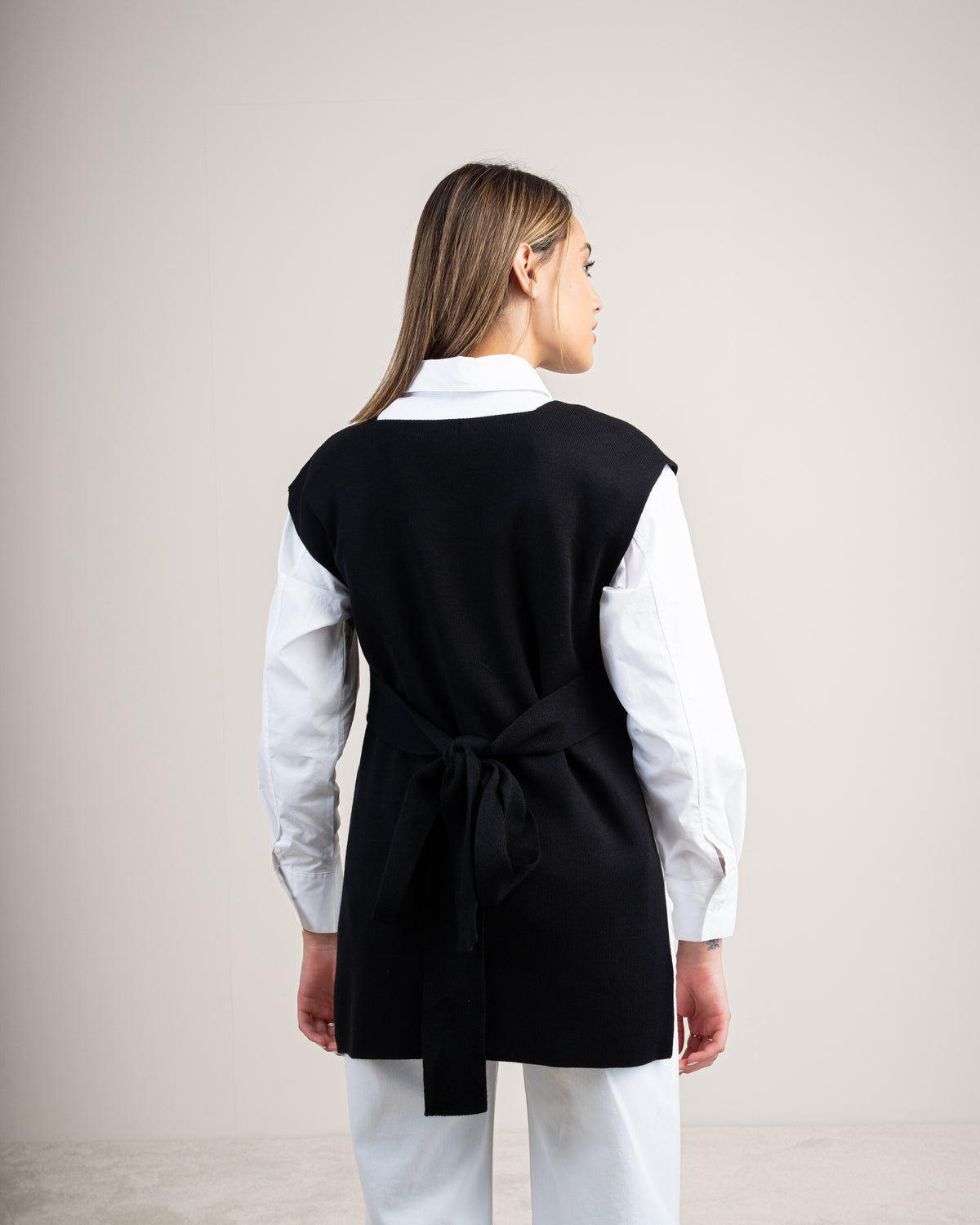 Knit vest with a tie-back detail